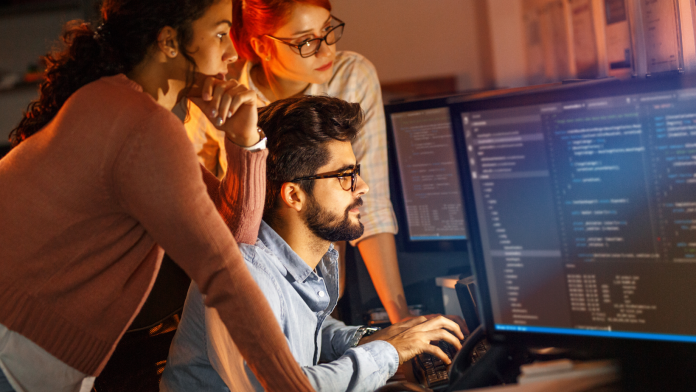 People coding on screen, representing non-traditional ways to land high-paying tech jobs without a formal degree