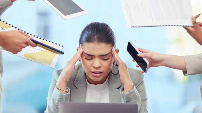 Tech professional experiencing burnout during their tech career as a result of overworking